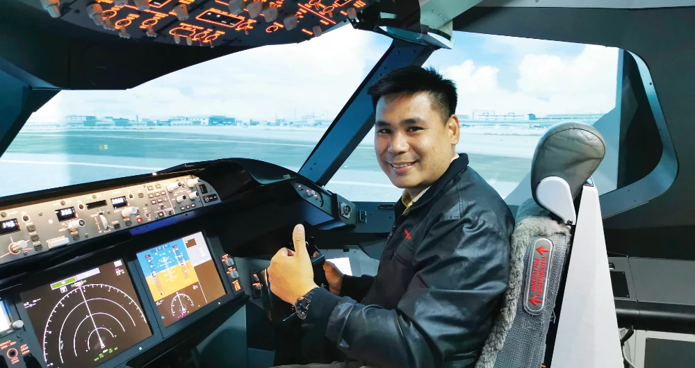 Thai commercial airline pilot Kritee Youngfuengmont has been furloughed and has taken on sidework as a deliveryman to supplement his income. (AP)