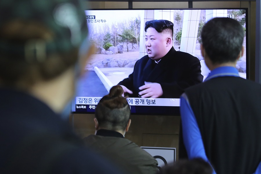 People watch a TV showing a file image of North Korean leader Kim Jong Un during a news program at the Seoul Railway Station in Seoul, South Korea, Saturday, May 2, 2020. (AFP)