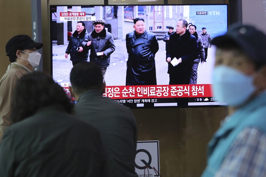 People watch a TV showing a file image of North Korean leader Kim Jong Un during a news program at the Seoul Railway Station in Seoul, South Korea, Saturday, May 2, 2020. (AFP)
