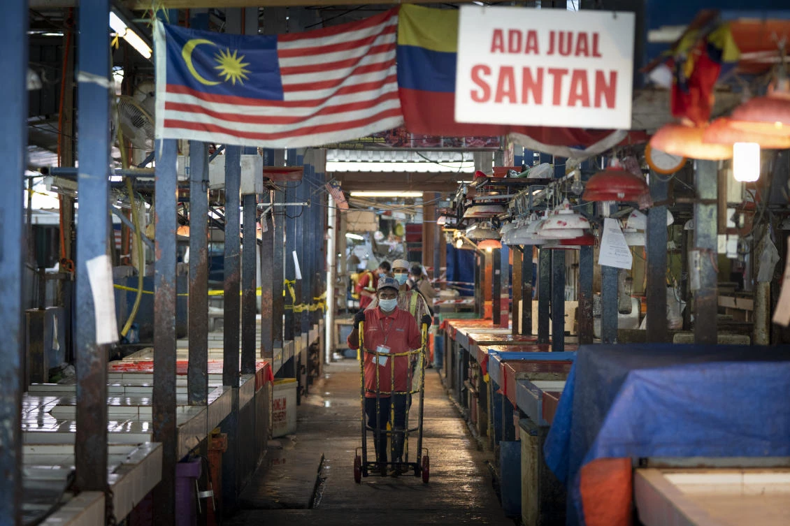 Malaysia’s economic sectors that involve large gatherings of people will not be allowed to reopen to help curb the spread of coronavirus. (AP)