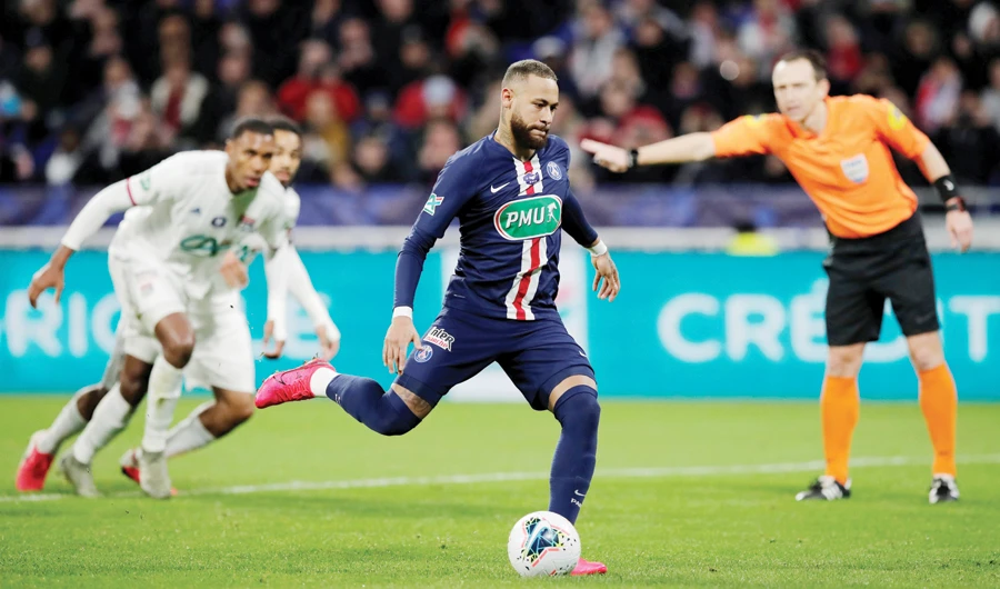 Paris St Germain’s Neymar scores their second goal through a penalty strike during their match against Olympique Lyonnais at Groupama Stadium in Lyon. (Reuters)