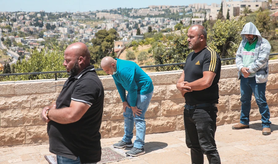 People pray in East Jerusalem’s Mount of Olives, overlooking the Dome of the Rock and Al-Aqsa Mosque compound. (AP)