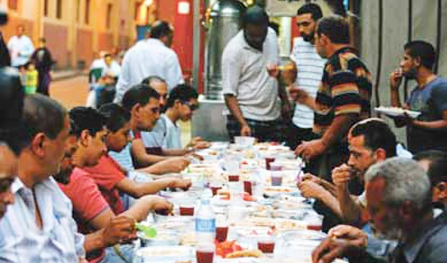 Muslims eat meals prepared by Coptic Christians during Ramadan in Cairo, Egypt. (Reuters)