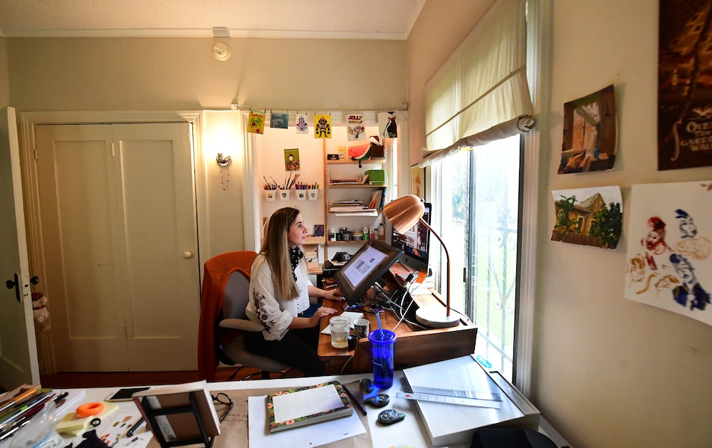Artist Reem Ali Adeeb works in her studio apartment in California. (AFP)