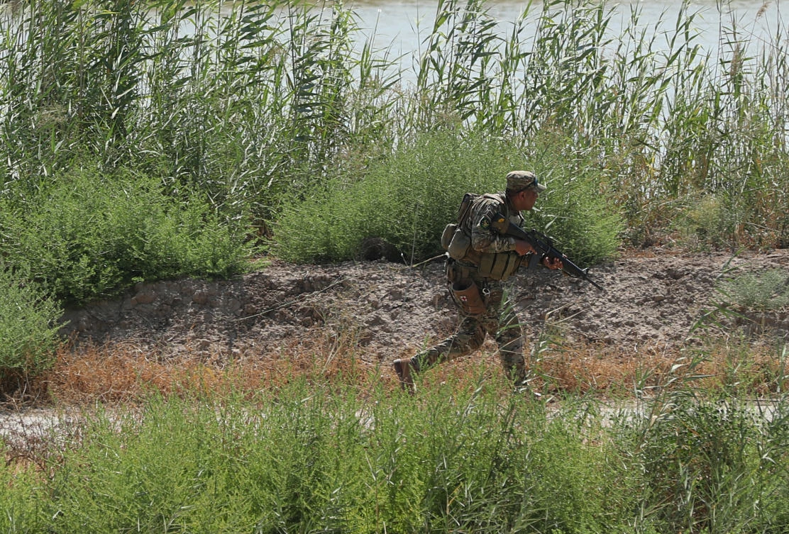 In this Tuesday, July 23, 2019 file photo, an Iraqi soldier searches for Daesh militants during search operation in Taramiyah, north of Baghdad, Iraq. (AP)