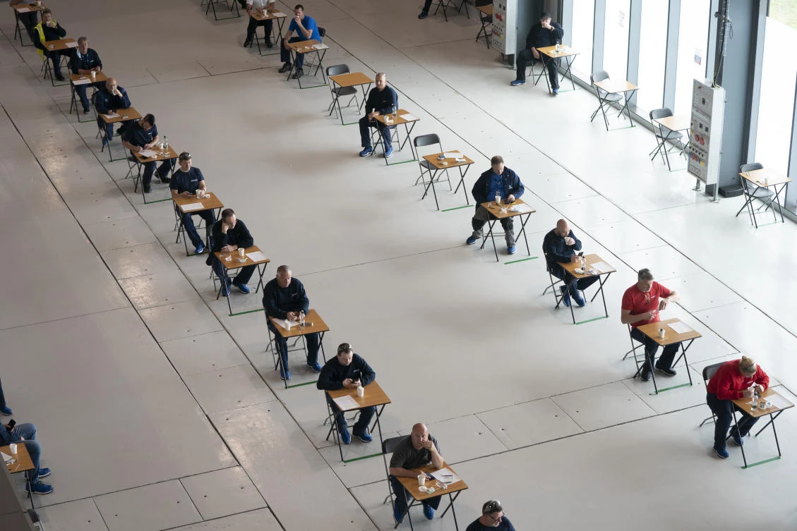 Workers keep their distance during a break from producing medical ventilators at AMRC Cymru as they help the UK in the fight against the COVID-19 coronavirus in Broughton, North Wales, on Thursday April 30, 2020. (AP)