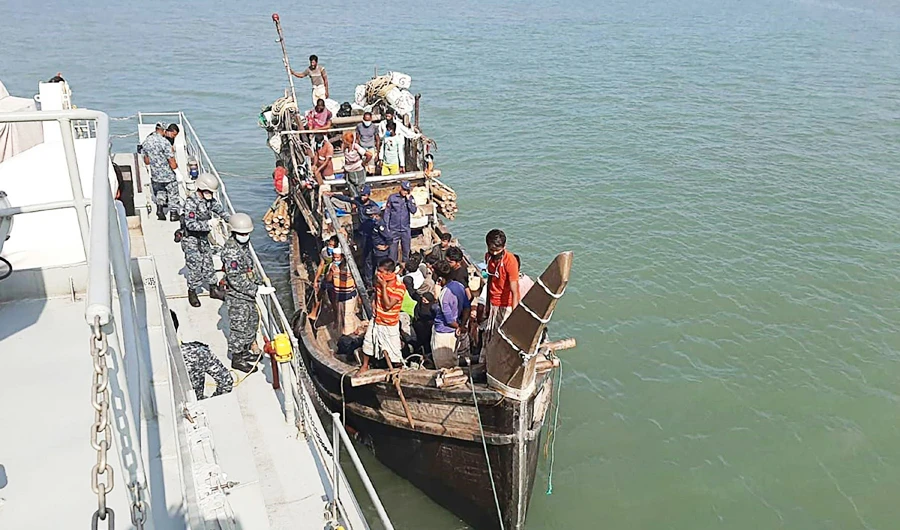 In this picture taken on May 2, 2020, Rohingya refugees stranded at sea are seen on a boat near the coast of Cox's Bazar. (AFP)