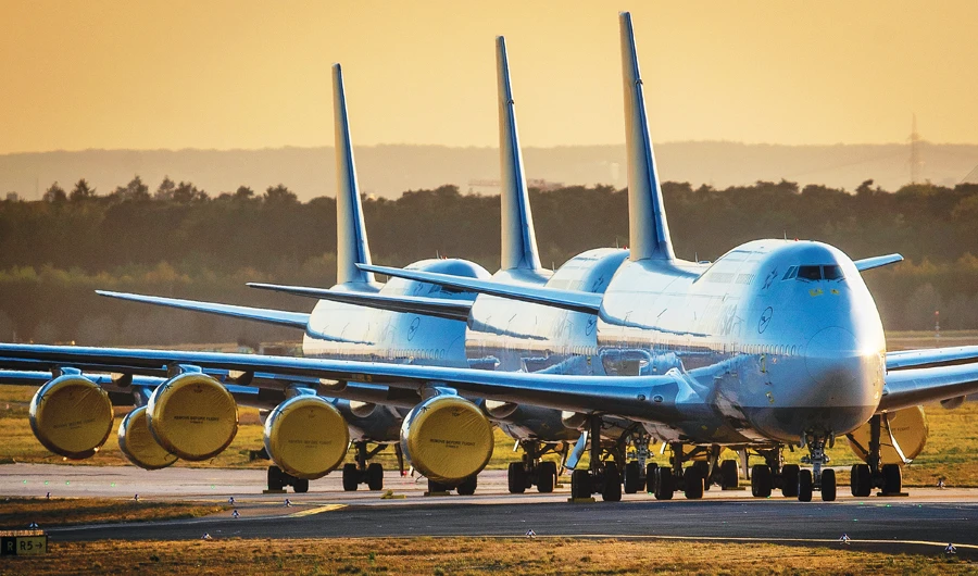 Boeing 747 aircrafts are parked at the airport in Frankfurt. Boeing says it will cut about 10 percent of its work force as it deals with the coronavirus crisis. (AP)