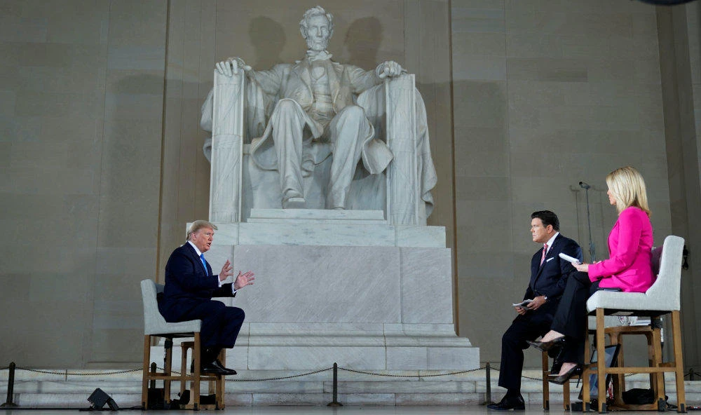 US President Donald Trump is interviewed by hosts hosts Bret Baier and Martha MacCallum during a Fox News Channel virtual town hall called "America Together: Returning to Work" about the response to the coronavirus disease (COVID-19) pandemic, inside the Lincoln Memorial in Washington on May 3, 2020. (REUTERS/Joshua Roberts)