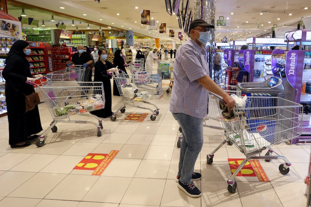 People follow social distancing markings as they line up at a shopping mall after the Saudi government eased a curfew and allowed stores to open, following the outbreak of the coronavirus disease (COVID-19), in Riyadh, Saudi Arabia May 2, 2020. (Reuters)