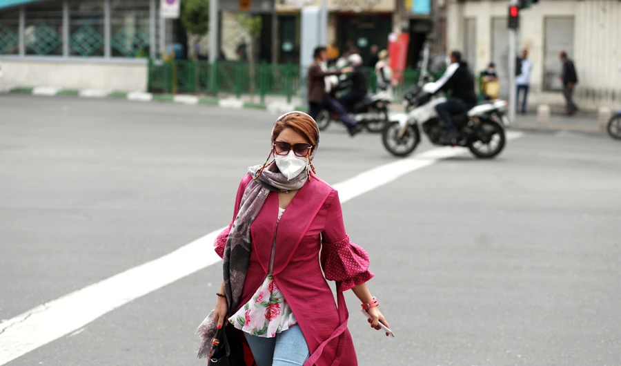 A woman wearing a protective face mask walks following the outbreak of the coronavirus disease (COVID-19), at Ferdowsi souq in Tehran, Iran, April 30, 2020. (REUTERS)