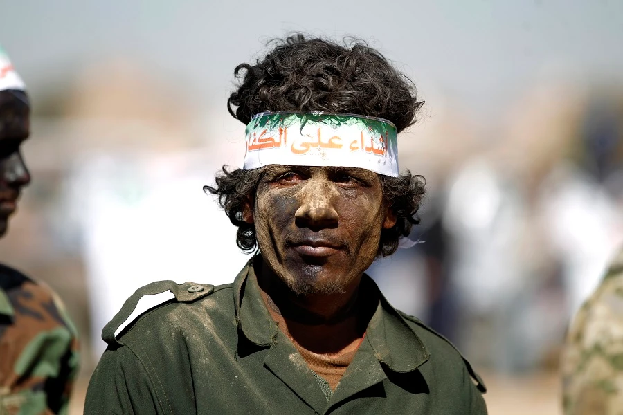 The Houthis will take four men from each district and force them to train as fighters. (File/AFP)