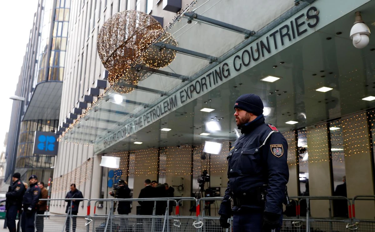 Journalists and police officers stand outside the Organisation of the Petroleum Exporting Countries (OPEC) headquarters, in Vienna, Austria, December 5, 2019. (Reuters)