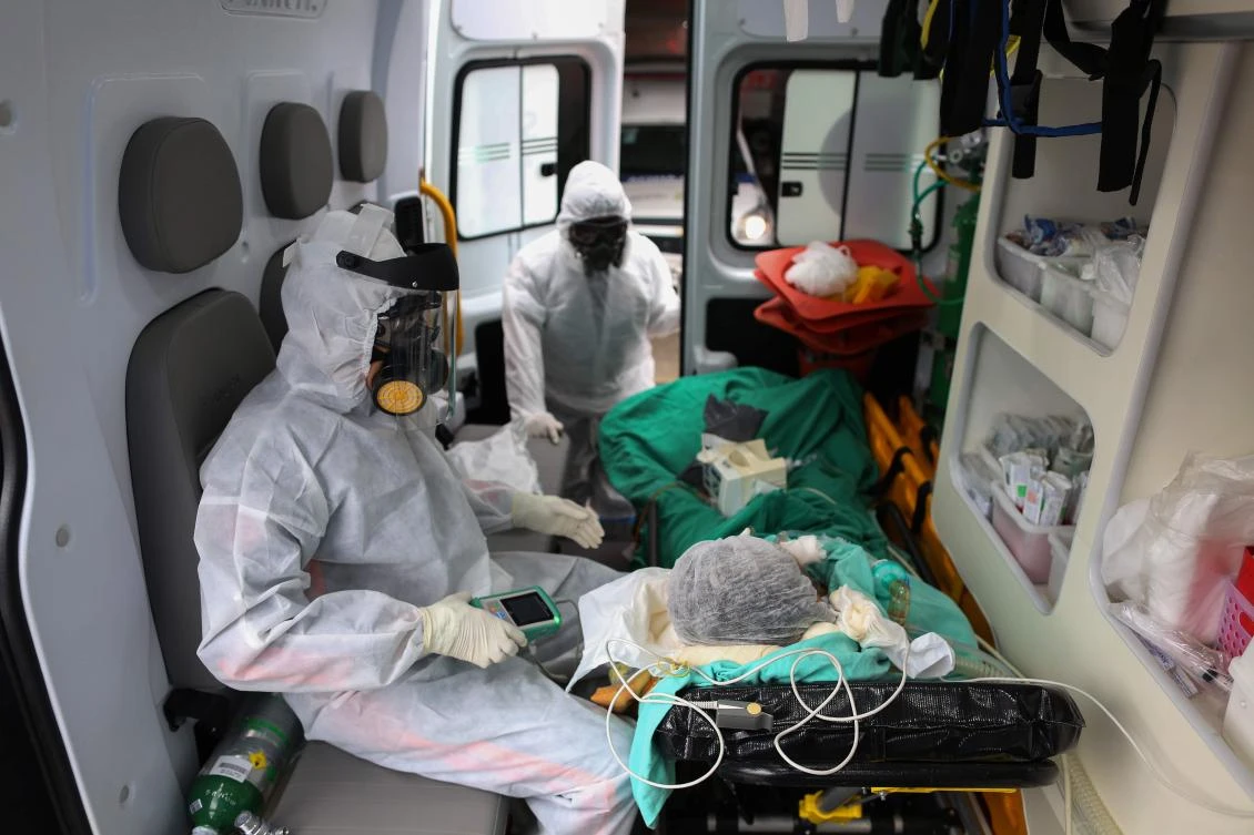 Emergency medical service staff arrive with a patient suspected of being infected with coronavirus in Manaus, Brazil on May 5, 2020. (AFP)
