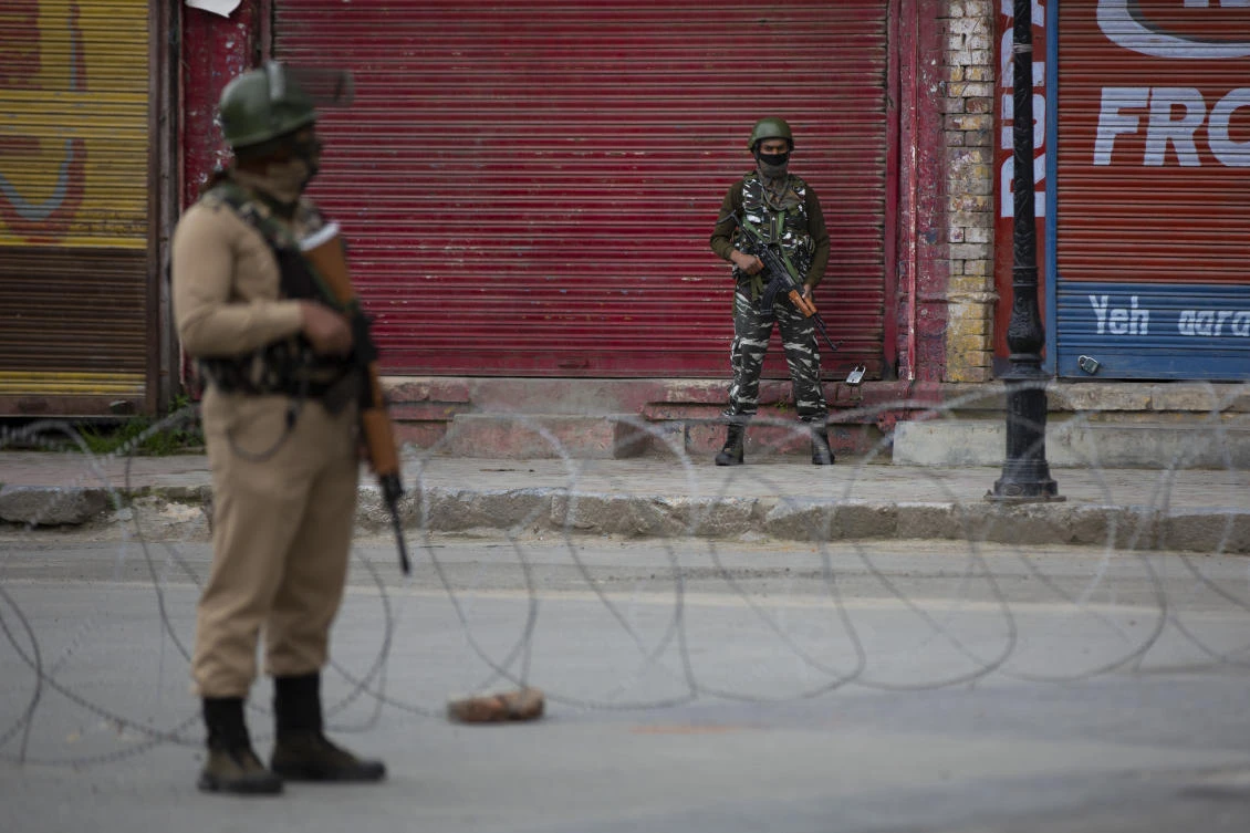 Indian paramilitary soldiers stand guard on a deserted road in Srinagar, Indian controlled Kashmir, Wednesday, May 6, 2020. Government forces killed a top rebel commander and his aide in Indian-controlled Kashmir on Wednesday and shut down cellphone and mobile internet services during subsequent anti-India protests, officials, and residents said. (AP)