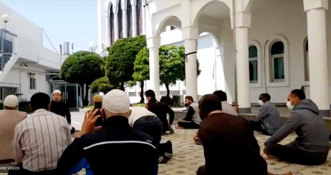 A screengrab from YouTube video channel shows Korean Muslims offering prayers outside the reopened Seoul Central Mosque on Wednesday. (Supplied)