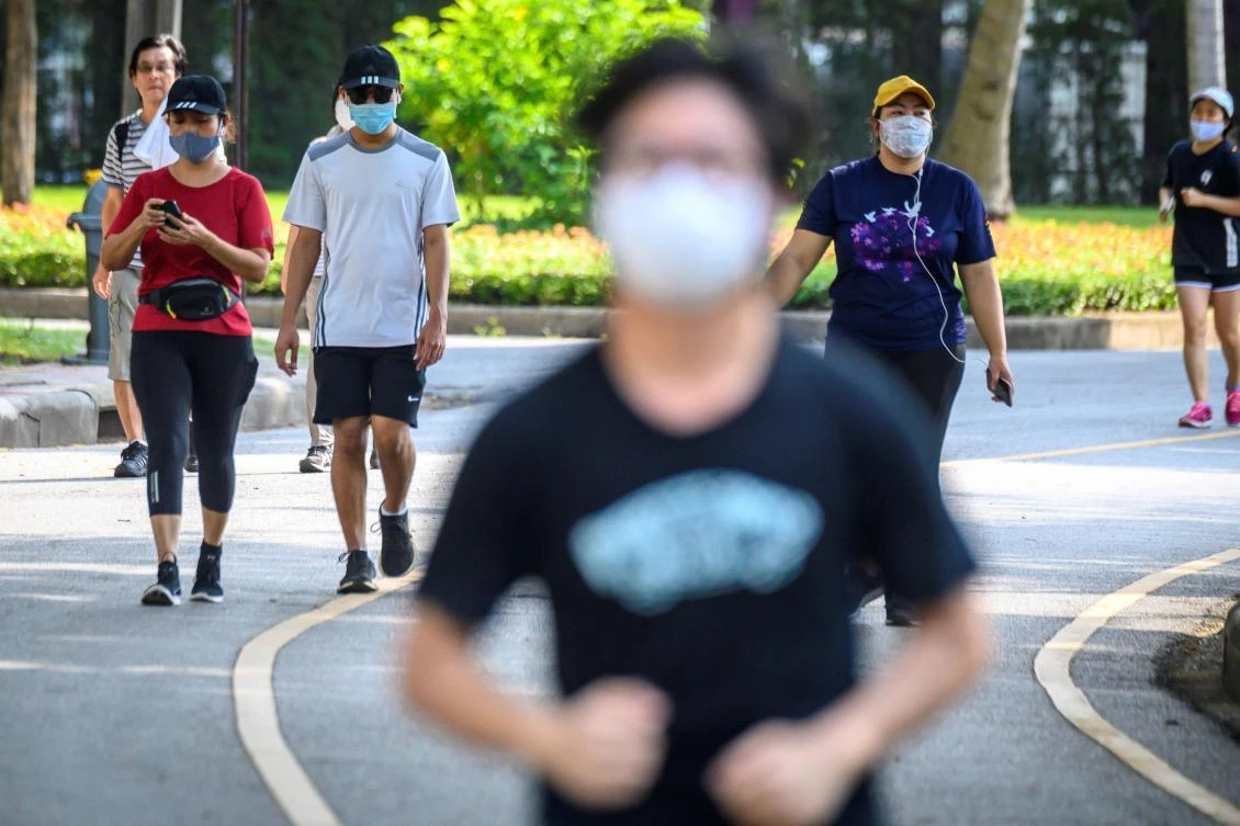 Above, joggers run in Lumpini Park in Bangkok, which was reopened after the Thai government relaxed measures to combat the spread of coronavirus, on May 3, 2020. (AFP)