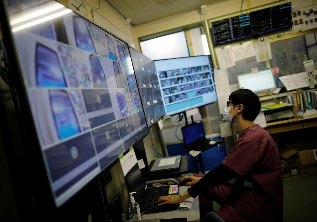 A medical worker monitors remotely patients at the Intensive Care Unit for coronavirus patients at St. Marianna Medical University Hospital in Kawasaki, south of Tokyo on Japan May 4, 2020. (Reuters)