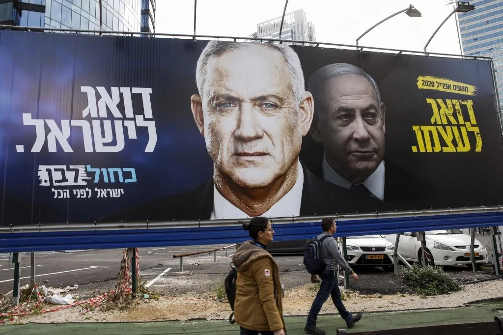 The Israeli parliament backed the coalition deal by 71 votes to 37, a statement said. Above, an electoral billboard featuring Prime Minister Benjamin Netanyahu and Benny Gantz. (AFP file photo)