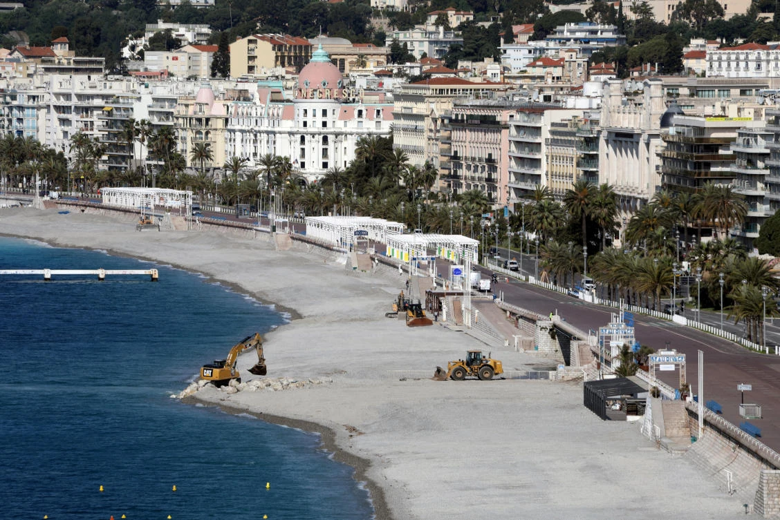 Construction machineries are seen in action on the deserted beach of the Promenade des Anglais in Nice during the outbreak of the coronavirus disease (COVID-19) in France, May 7, 2020. (Reuters)