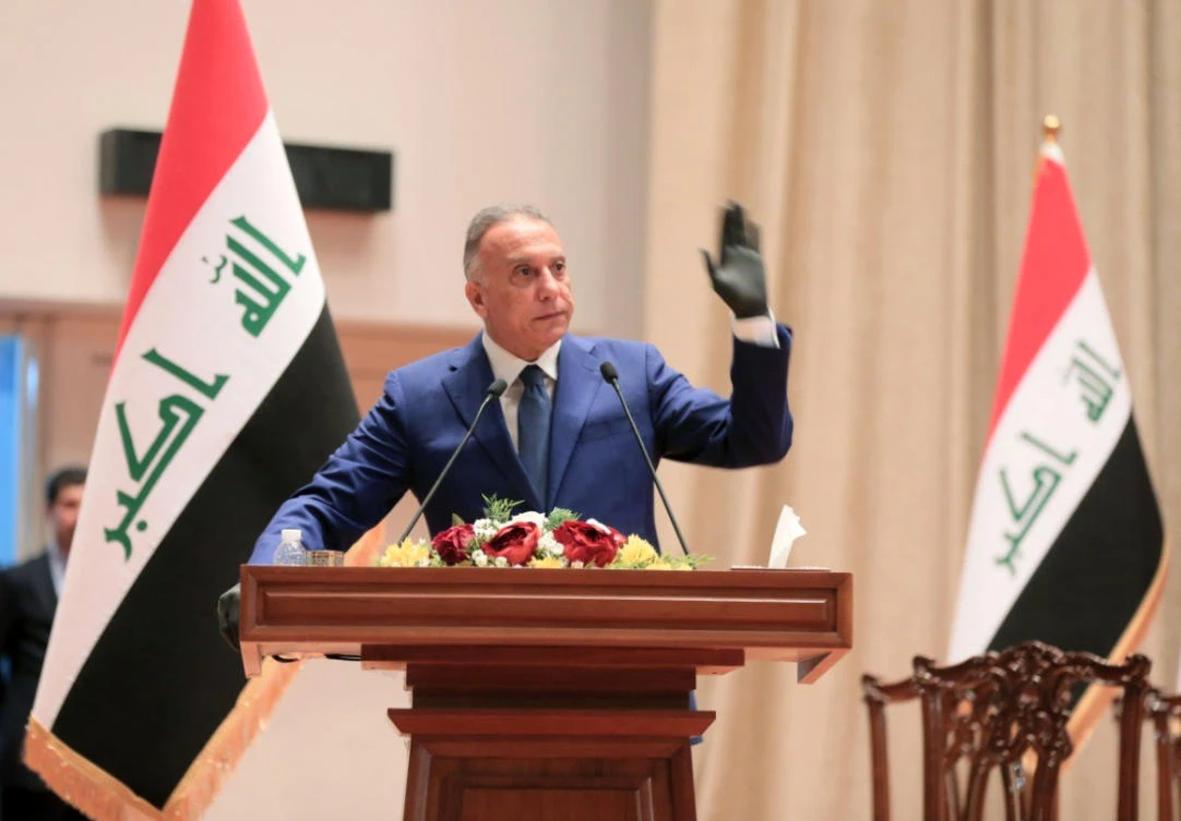 Iraqi Prime Minister Mustafa Al-Kadhimi takes the oath in front of Iraq's parliament during an overnight session in Baghdad. (AFP)