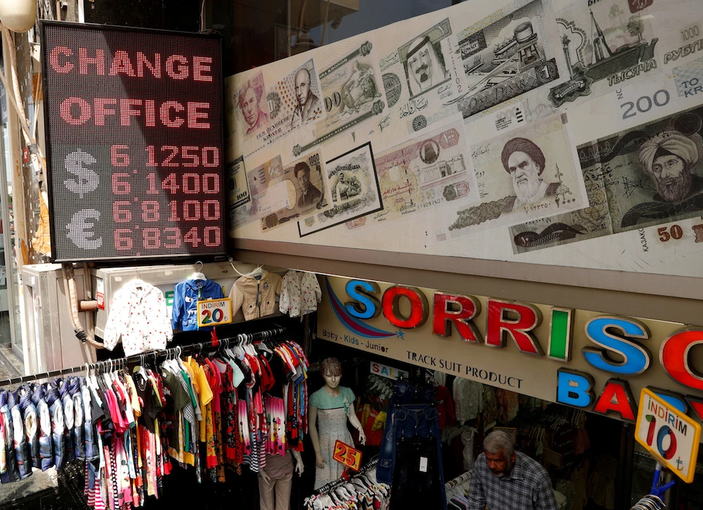 A board showing the currency exchange rates of the U.S. dollar and the Euro against Turkish lira is seen outside a currency exchange office in Istanbul, Turkey. (Reuters)