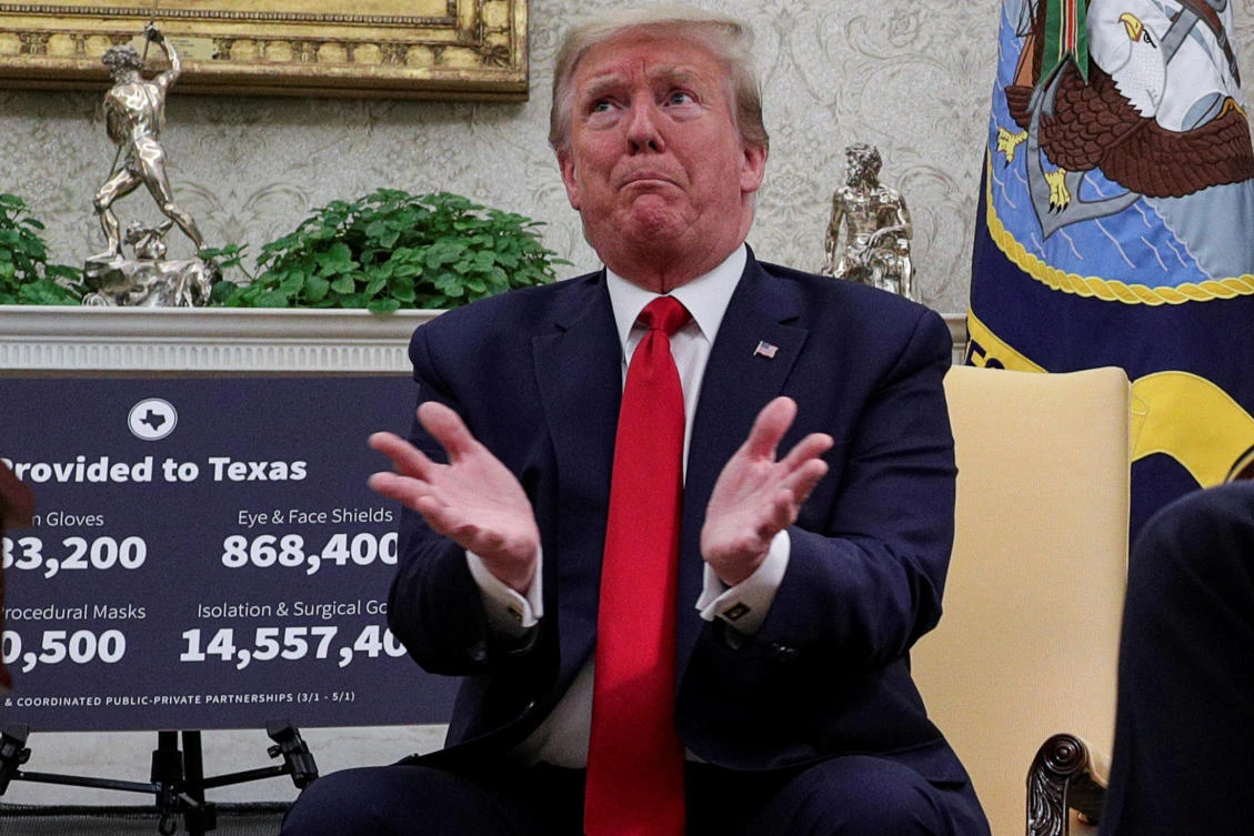 US President Donald Trump gestures during a meeting about the coronavirus disease (COVID-19) response with Texas Governor Greg Abbott in the Oval Office at the White House in Washington, US, May 7, 2020. (Reuters)
