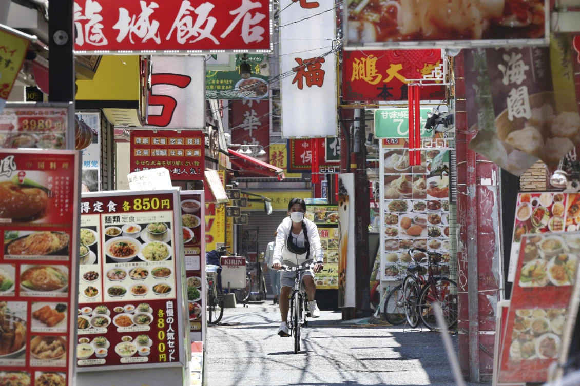 The Japanese economy likely shrank for a second straight quarter in the first three months of this year, a poll shows. (AP)