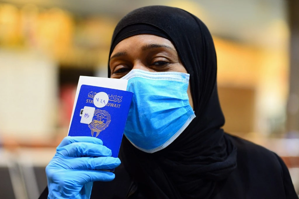 A Kuwaiti national waits to board a repatriation flight at Najaf International Airport in Iraq on May 5, 2020. (AFP)