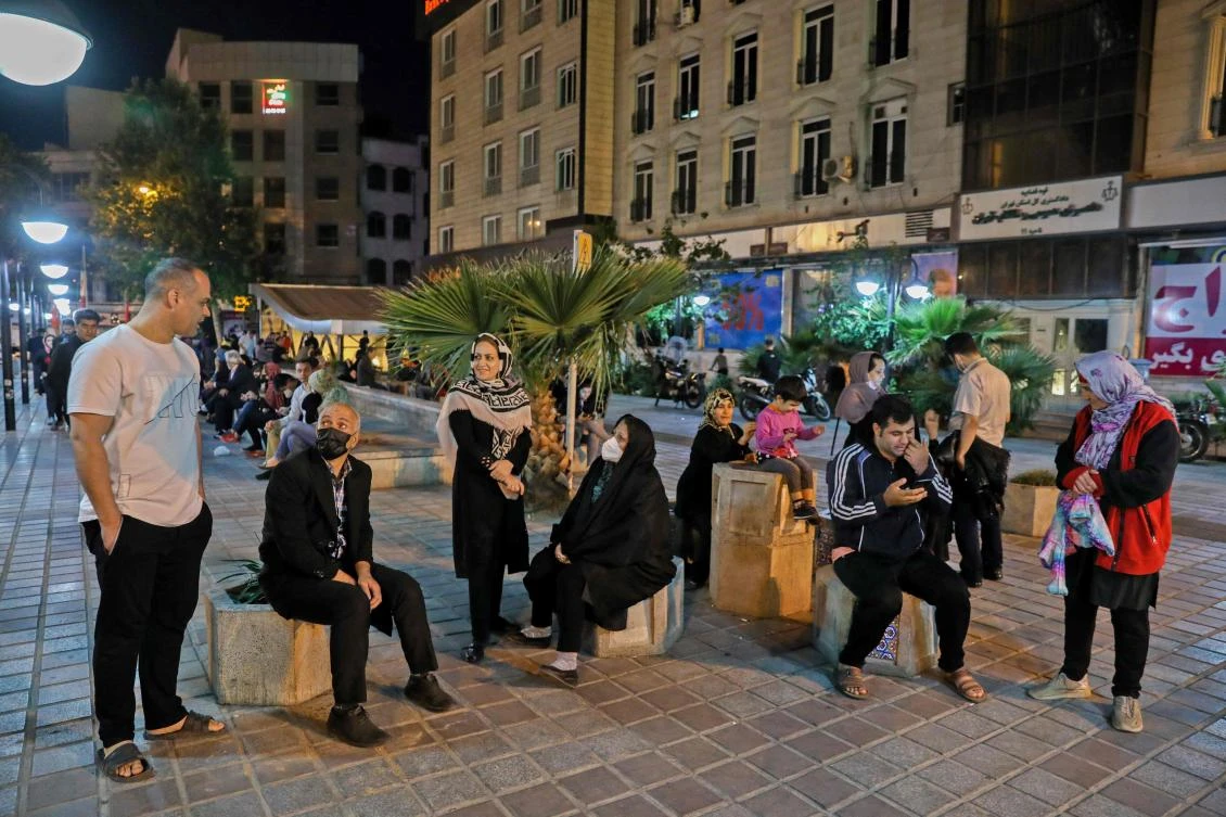 Iranians gather outside their buildings after a 5.1 earthquake was felt in the capital Tehran on May 7, 2020. (AFP)