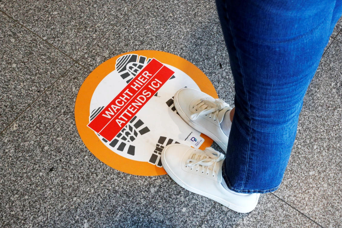 Social distancing signs around the world show the new normal