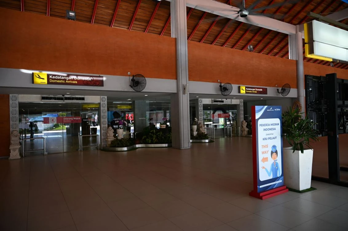 Above, an empty domestic arrival hall at Ngurah Rai airport in Tuban in Bali, Indonesia on May 8, 2020 with the air travel ban still in place. (AFP)