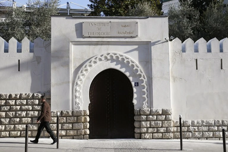 A man passes by the entrance to the Al-Ghazali theology institute of the Grand Mosque of Paris. (AFP