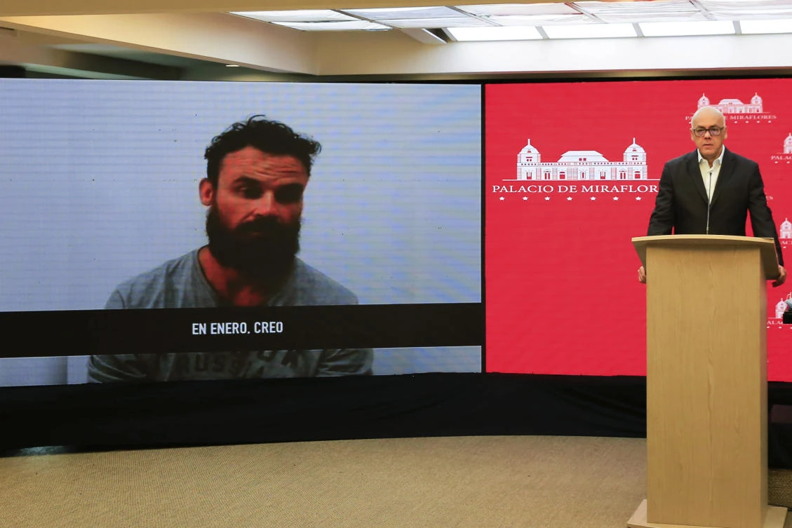Venezuela’s Minister for Communication Jorge Rodriguez shows a video of former US special forces soldier Airon Berry, during a televised statement in Caracas, May 7, 2020. (AP Photo)