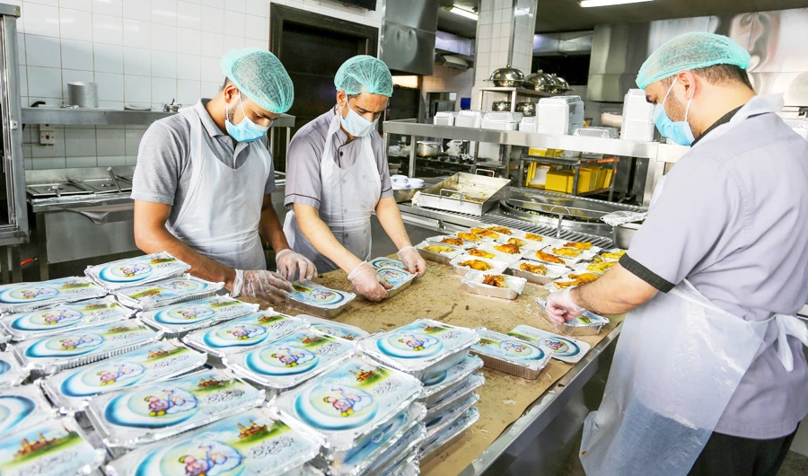 Kitchen staff prepare Ramadan meal orders for takeaway in Riyadh. (Reuters)