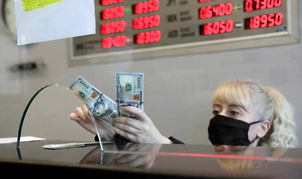The Turkish lira fell to 7.26 against the dollar on Thursday, surpassing the previous record low of 7.24 reached during a currency crisis in August 2018.(AP Photo/Burhan Ozbilici)