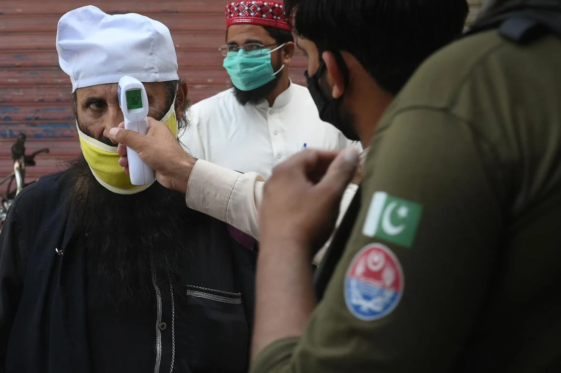 Pakistan’s prime minister Imran Khan said he was ending the lockdown as his government was unable to help those millions of people who rely on their daily earnings to survive and feed their families. (AFP)