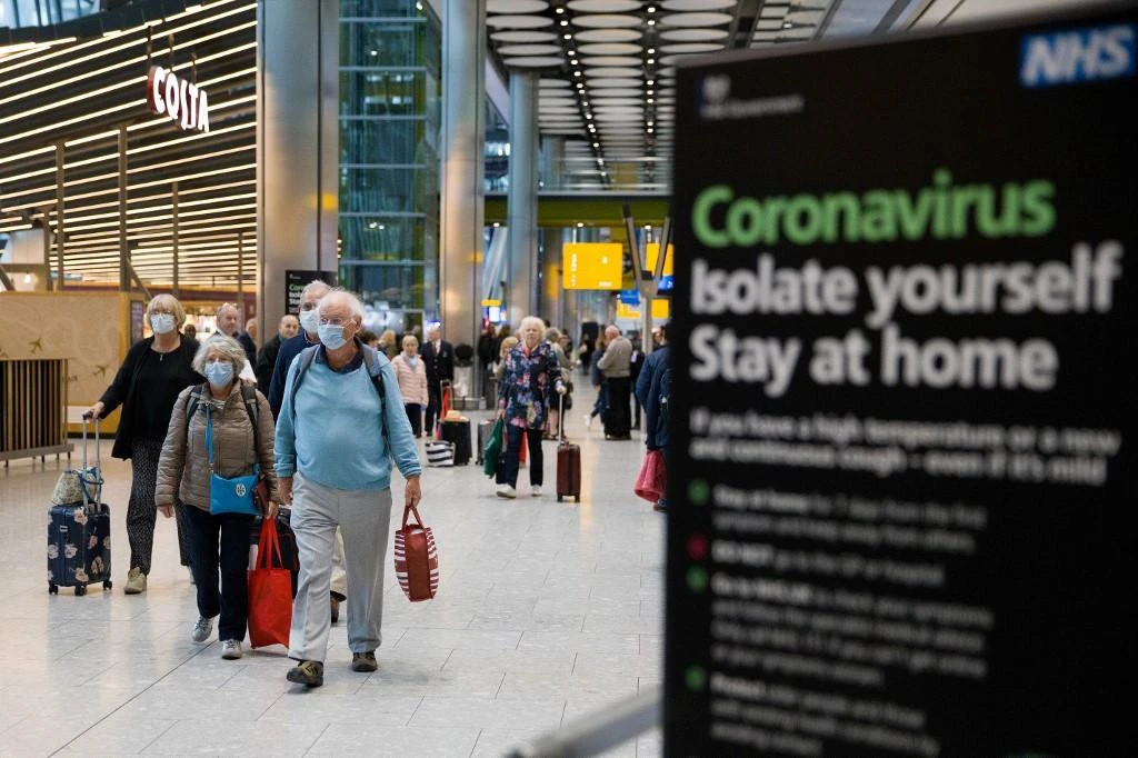 The 14-day mandatory quarantine for most international arrivals would be enforced by spot-checks on the address given by travelers, with possible penalties including fines of up to $1,200 or deportation. (AFP)