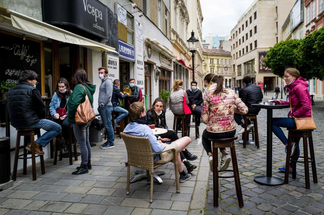 People sit at the terrace of a cafe in Bratislava on May 6, 2020, amid the novel coronavirus COVID-19 pandemic. (AFP)