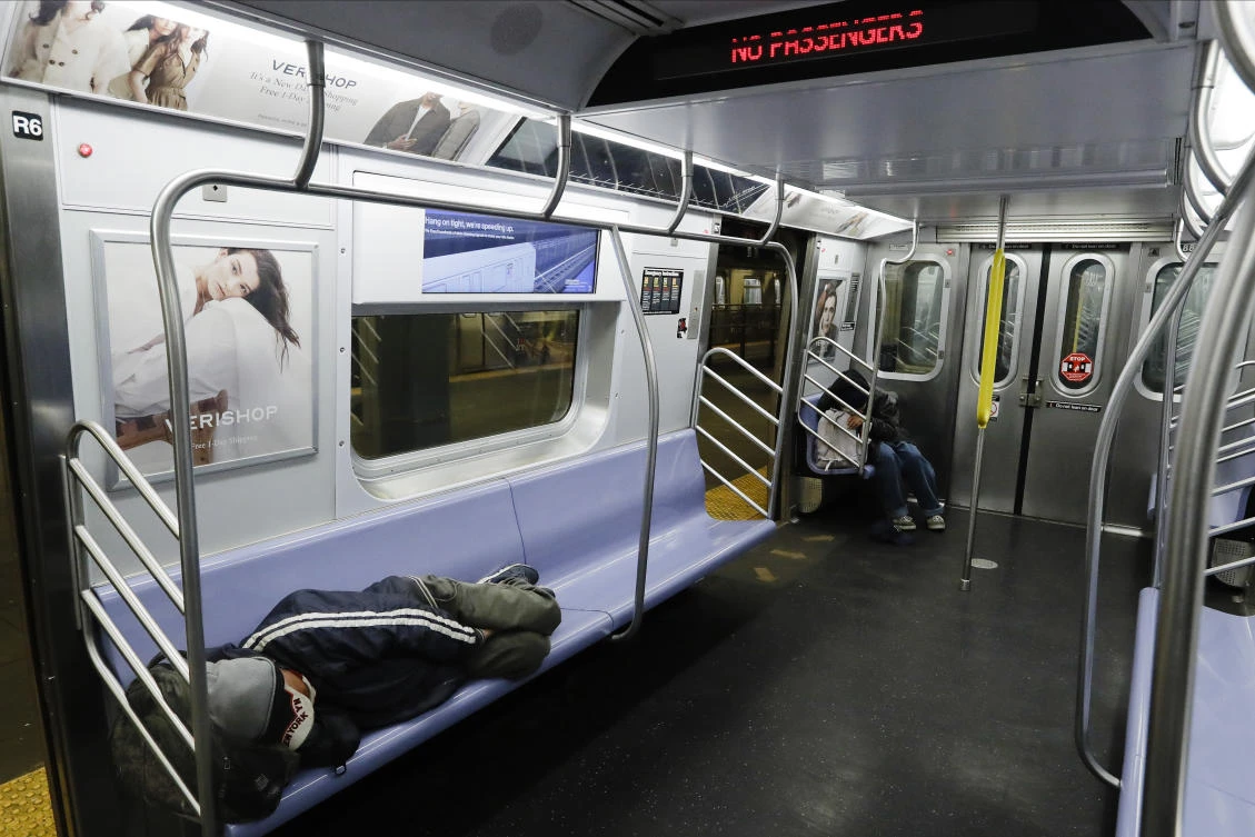 New York City transit officials said they're providing buses for homeless people to shelter from unseasonably frigid temperatures this weekend during newly instituted overnight subway closures. (File/AP/Frank Franklin II)