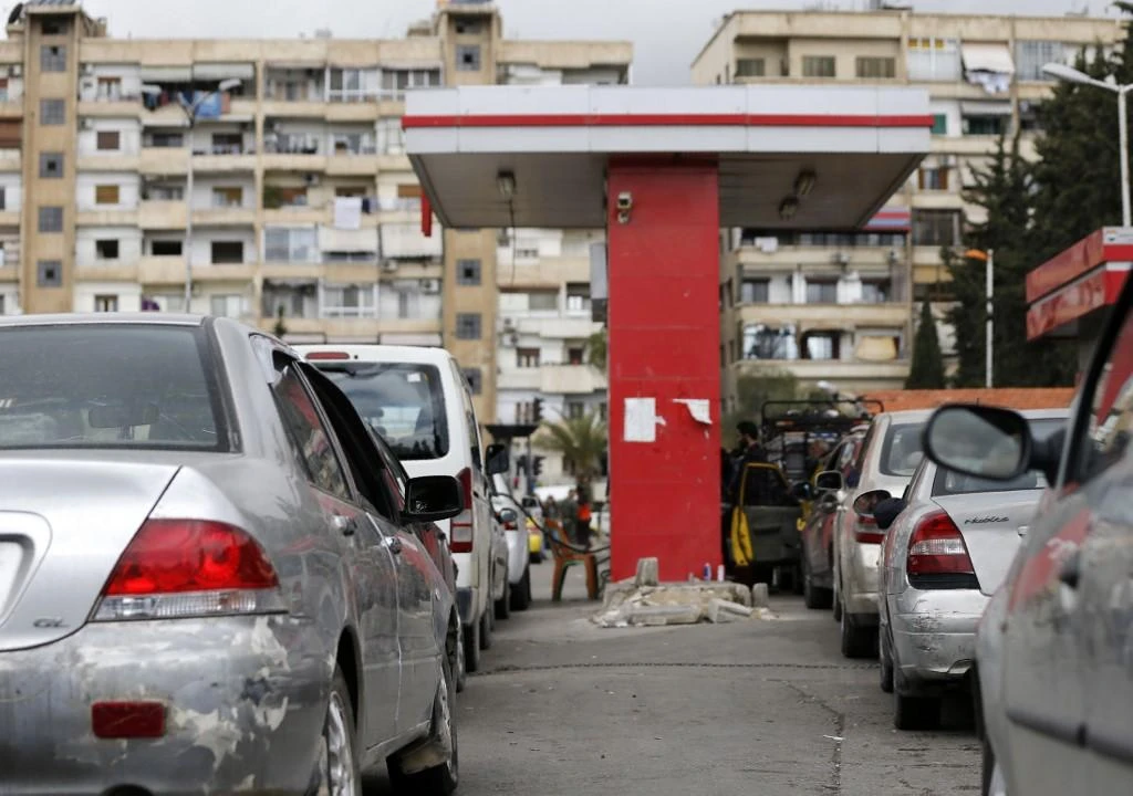 The ministry said it was revising down its fuel subsidies, excluding from its ration system users of cars with engines of 2,000 cubic centimeters or more, as well as owners of more than one car. (File/AFP)