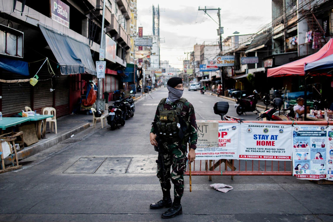 A soldier guards an empty street following the lockdown imposed to contain the coronavirus disease in Manila, Philippines, April 24, 2020. (Reuters)