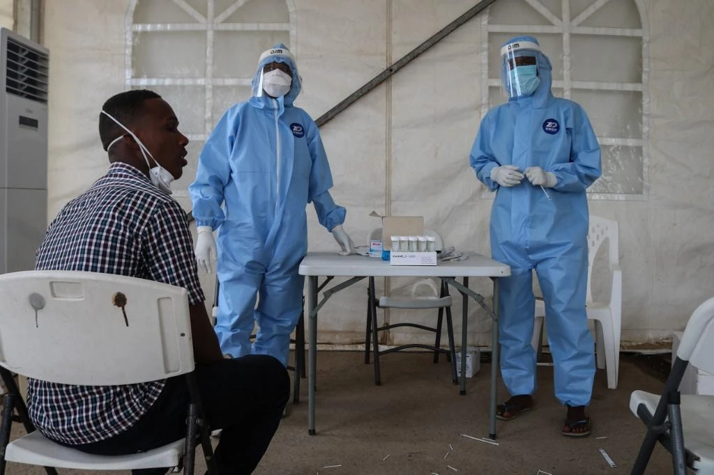 Staff members of the Ministry of Health prepare to take samples for testing for the COVID-19 coronavirus at the testing unit at the Bouffard hospital in Djibouti on May 2, 2020. (File/AFP)