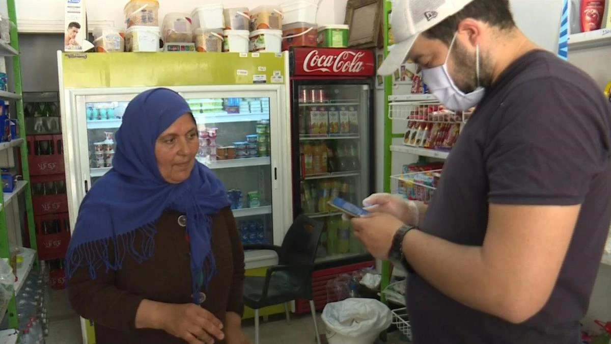 A Tunisian NGO has set up a food bank that dispenses aid by text message to some 300 needy families rendered more vulnerable because of the coronavirus pandemic. (AFP)