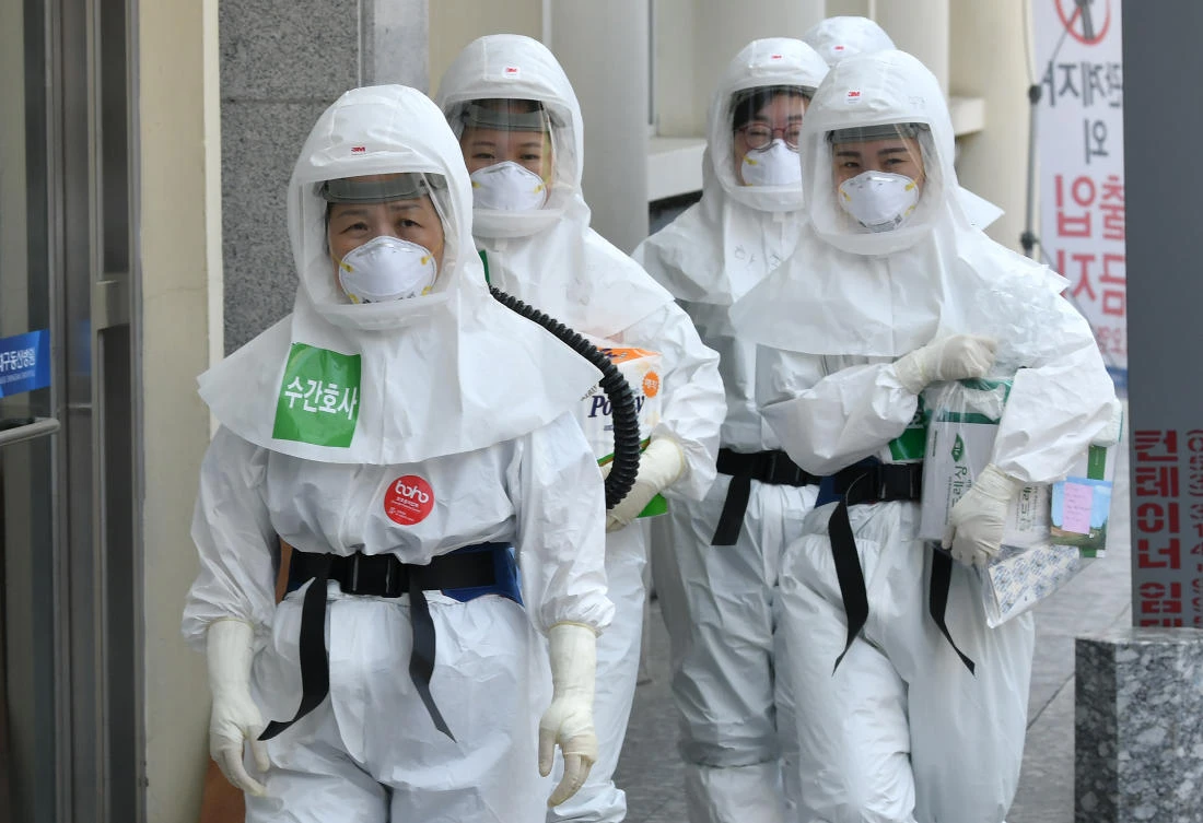 South Korean nurses wearing protective gear arrive for their shift to care for patients infected with the COVID-19 coronavirus at Keimyung University Daegu Dongsan Hospital in Daegu. (File/Jung Yeon-je/AFP)