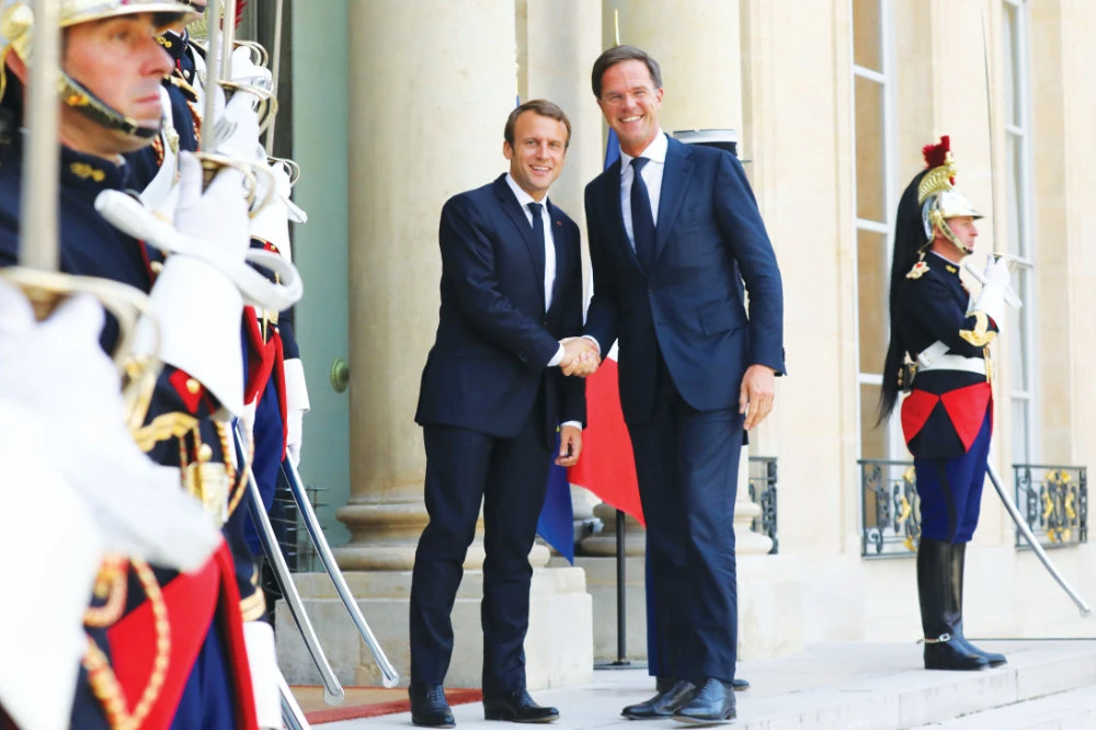 French President Emmanuel Macron welcomes Dutch Prime Minister Mark Rutte at the Elysee Palace in Paris. (Reuters File Photo)
