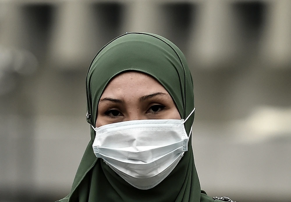 A hijab-wearing woman with a face mask. (File/AFP)