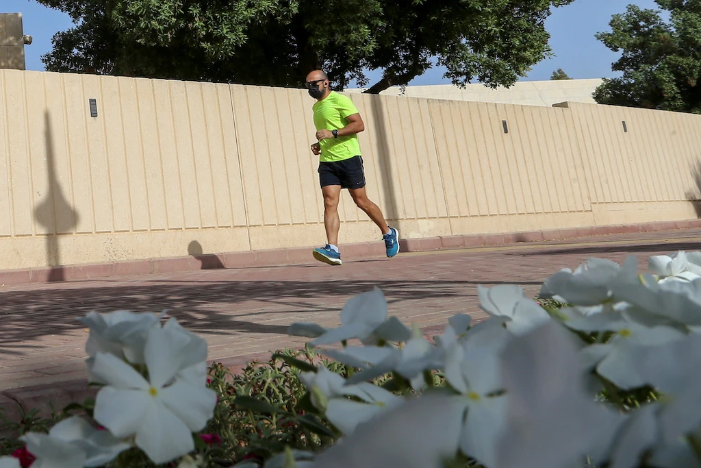 A man wears a protective face mask while jogging, following the outbreak of the coronavirus disease (COVID-19), in Riyadh, Saudi Arabia May 13, 2020. (Reuters)
