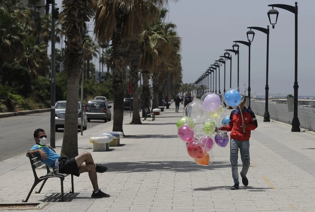 A man sells ballons at Beirut seaside corniche on May, 13, 2020. (File/AFP)