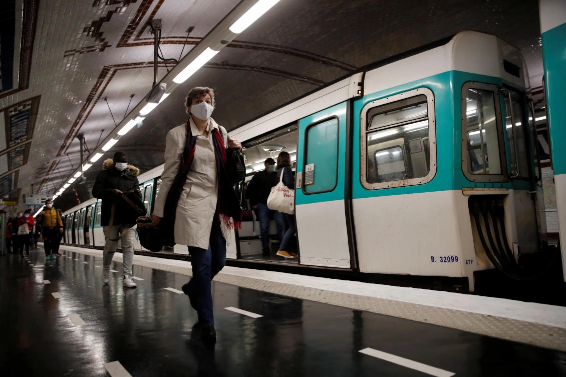 A vaccine could allow countries and economies to fully re-open from lockdowns and potentially earn millions of dollars for its creators. Above, people wearing protective face masks walk on a platform at a metro station of Paris transport network in France on May 11, 2020. (Reuters)